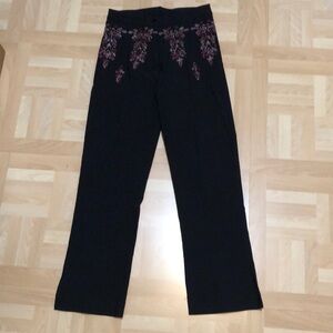 Black pants with lavender embroidered design